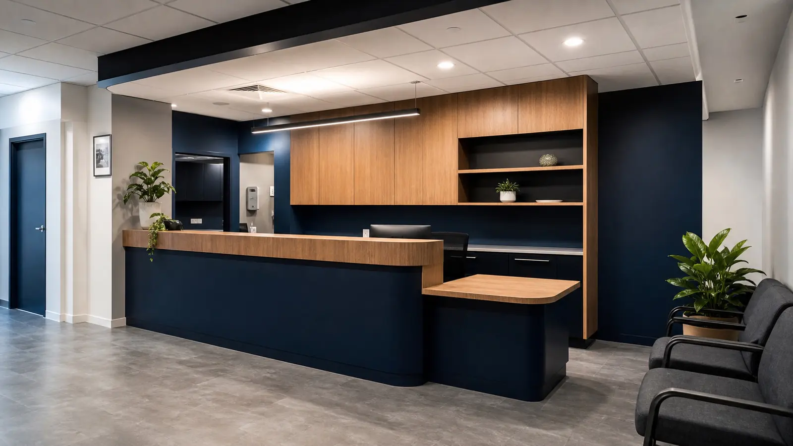 Commercial reception counter with custom cabinetry and shelving